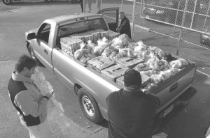 Connecticut Food Bank volunteers get ready to distribute a truck full of food designated for the Thanksgiving holidays.
