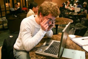 Mike Lavigne ’09 rubs his eyes while studying in the Bass Library cafe. Staying awake for prolonged periods may damage the eyes.