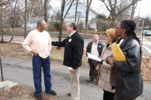 DeStefano, along with alderwowmen Julia Santos, left, and Lensley Gray, speaks to Garry Monk while canvassing for Obama on Saturday.