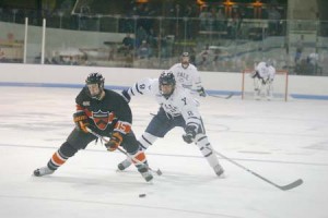 Forward Patrick Brosnihan ’09 pursues Tiger defenseman Matt Godlewski during an early season contest against Princeton. The Elis will face a Dartmouth team this weekend that has yet to win an Ivy game.