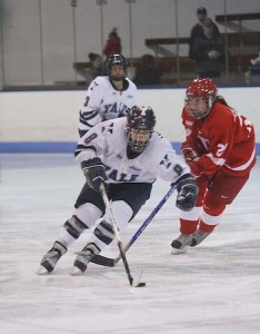 Crysti Howser ’08 works the puck down the ice in a 5-0 ECAC thrashing of the Cornell Big Red on Jan. 26.