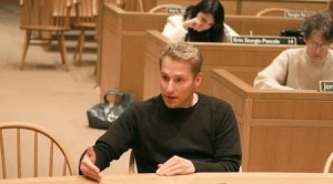 Mark Volchek ’00 GRD ’00, the airport authority chairman, speaks with the Board of Aldermen about plans to expand New Haven’s Tweed Airport in City Hall on Thursday.