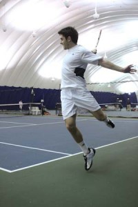 Rory Green ’08 hits a backhand during his 8-3 doubles win with partner Calvin Bennett ’11 on Friday night.
