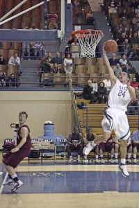 Now in the starting lineup, guard Alex Zampier '10, here against Harvard on February 8, has helped rejuvenate the Elis.