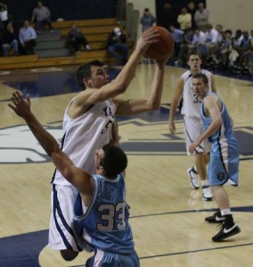 Travis Pinick ’09 takes the contact from Columbia’s Joe Bova in a 71-58 home loss. Both Columbia and Yale are trying to catch conference leader Cornell.