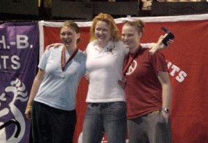 Jamie Redman ’08 (left), Tess Garrand ’10 (center) and Taylor Ritzel ’10 (right) celebrate after a 1, 2, 3 collegiate finish at the CRASH-Bs.