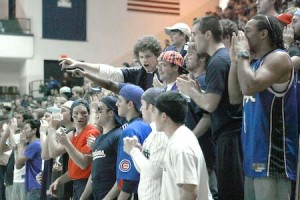Fans belonging to the “Little League” cheer the Yale men’s basketball team against Harvard on Feb. 8 at home.