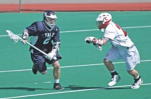 Attackman Brendan Gibson ’10 jukes past a Cornell defender during the Big Red’s narrow 8-7 overtime win at Reese Stadium on Saturday.