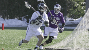 Tyler Casertano ’08, who scored two goals against Hartford last night, runs past a Holy Cross player Feb. 24 at Reese Stadium. The Elis beat the Hawks, 11-3.