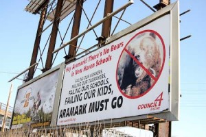 A billboard near Union Station criticizes food and custodial-services supplier Aramark, which is preparing a bid to renew its contract in New Haven public schools.