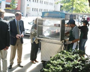 Customers purchase food from the Jasmine food cart on Church Street. Carts are often affiliated with restaurants in the New Haven area.