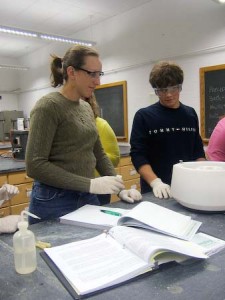 Students work together during a laboratory for Chemistry 116. Recent data have led some administrators to worry that students are leaving the sciences.