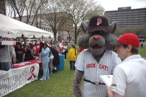The mascot of the New Britain Rock Cats hangs out at the AIDS Walk on the New Haven Green yesterday.