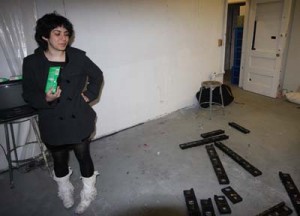 In her studio last week, Aliza Shvarts ’08 holds a tape she claims shows her bleeding into a cup for her senior art project.