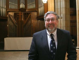 Alex Knopp, who will succeed Kathrine Burdick as executive director of Dwight Hall, poses in Dwight Chapel. “Dwight Hall’s superb record of encouraging a civic-minded attitude,” he said, “leads to a lifetime of commitment for social change.”