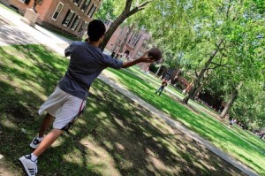 Freshmen toss a football on Old Campus as Camp Yale winds down, among a whirlwind of activities marking their first days at Yale.