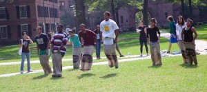 Students compete in a potato-sack race at the first-ever Intercultural Field Day, which aimed to attract students from various cultural houses and organizations.