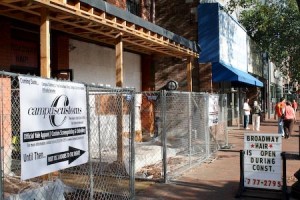 American Apparel will likely not be moving into its site, currently occupied by Campus Customs, until March.