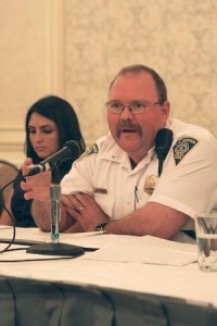 A New Haven Police Department officer discusses the department’s new stance on public disturbance at a Thursday meeting.