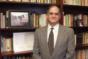 Joseph Gordon GRD ’73, pictured in his office, was tapped to serve as interim dean while the search for a new dean continues.