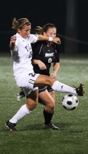 Midfielder Megan Ashforth ’10 catches Bryant’s Regina Burdo across the face with her sweat band as she challenges for a ball during Yale’s 2-0 win at Reese Stadium on Wednesday night. Yale will visit Harvard on Saturday.