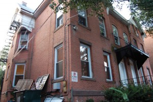 David Light, arraigned on charges including reckless endangerment, criminal attempt to manufacture bombs and possession of weapons in the former Beta house, pictured here, had all but three dropped.
