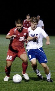 Defender Max Rhodes ’09 fights for the ball during a scoreless tie against Sacred Heart on Sept. 20.
