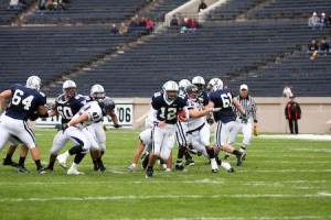 Quarterback Brook Hart ’11 runs the ball through the Penn defense in the Elis’ 9-7 loss at home on Saturday. Yale couldn’t rush the ball, and their pass game suffered.