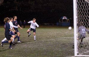 Midfielder Andy Hackbarth ’12 takes a shot on a cross from midfielder Jordan Raybould ’10 to score his first career goal and the Elis’ only goal in the match against Penn on Oct. 25.