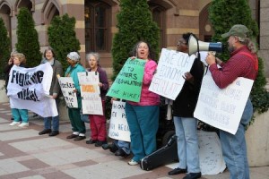New Haven residents outside United Illuminating Co.’s headquarters protest UI’s proposed statewide increase on utility rates