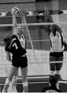 Bridget Hearst ’12 and Laurel Johnson ’09 block a Princeton ball for the Elis on Oct. 17. This weekend, Yale swept Columbia and Harvard.
