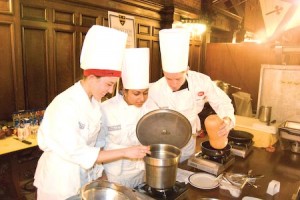 Lauren Harrison '09, Paula Chatterjee '09 and Sandy Gill '09 compete for Ezra Stiles in the first annual “Iron Chef: The Final Cut” competition.