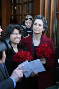 The first couple to apply for a gay marriage license in New Haven is all smiles while exiting City Hall