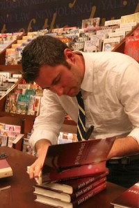 Mickey Rapkin signs his book “Pitch Perfect” after speaking about it at Barnes & Noble on Thursday.