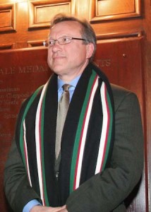 Music professor Richard Lalli, donning his new JE scarf upon being named master last winter, has been hospitalized after sustaining a brain hemorrhage.