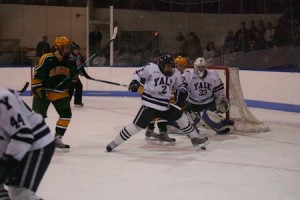 Defenseman Jimmy Martin ’11 puts his soccer skills to use on the ice as he blocks the puck in front of the Elis’ goal against Clarkson on Friday night at Ingalls Rink.