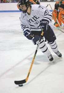 Mark Arcobello ’10, shown here controlling the puck against Clarkson on Dec. 2, 2006, scored two goals against Quinnipiac on Friday in a 3-3 tie. The contest extended Yale's unbeaten streak to 10 games.