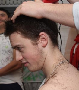 Yale hockey player Kevin Peel ’12 prepares for playoff season by getting his hair shaved into the shape of a ‘Y.’