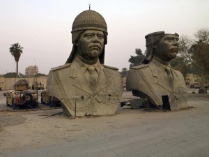 Saddam head statues, removed from the roof of the Republican Palace, languish in a car park at FOB Prosperity in central Baghdad. There were originally four heads; one is missing, and the other was melted down to make coins.
