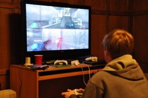 A Yale student fights on the map” Construct” in Halo 3. The player on the bottom screen, armed with an energy sword, is about to die.