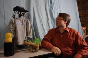 Computer science professor Brian Scassellati designed and built a robot with the intelligence of a 6-month-old infant. The robot was developed to interact with autistic children.