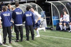 Student manager Casey Logan ’10 (left) stands with the men’s soccer team last November.