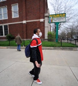 A boy walks past Kilmer Elementary School on Wednesday. The Chicago school is closed after a confirmed case of swine flu.