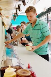 The reasonable prices, six yogurt flavors and 45 different toppings in a self-serve lounge and free T-shirts at Froyo World have attracted many students.