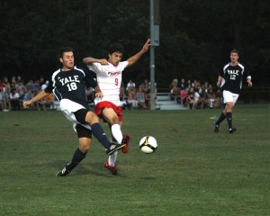 Midfielder Jenner Fox ’14 challenges Nuno Rodrigues of Fairfield on Tuesday night. The Elis eventually lost 2–1 in double overtime.