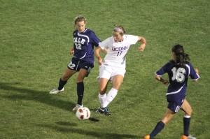 Defender Shannon McSweeney ’14 challenges UConn’s Meghan Cunningham for the ball. McSweeney and the Elis could not hold the Huskies off Thursday night.
