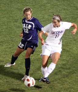 Defender Shannon McSweeney ’14 battles UConn’s Meghan Cunningham on Sept. 2 in the Elis’ 2–0 loss to the Huskies.