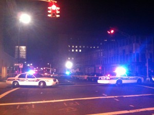 New Haven and Yale police officers cordoned off a large section of College Street Sunday morning after a shootout at the intersection with Crown Street.