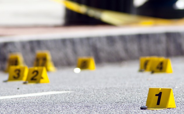 Bullets litter the street in the wake of Sunday morning's shooting.