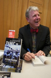 Science journalist Richard Preston signed copies of his book after his talk at Kroon Hall on Monday.